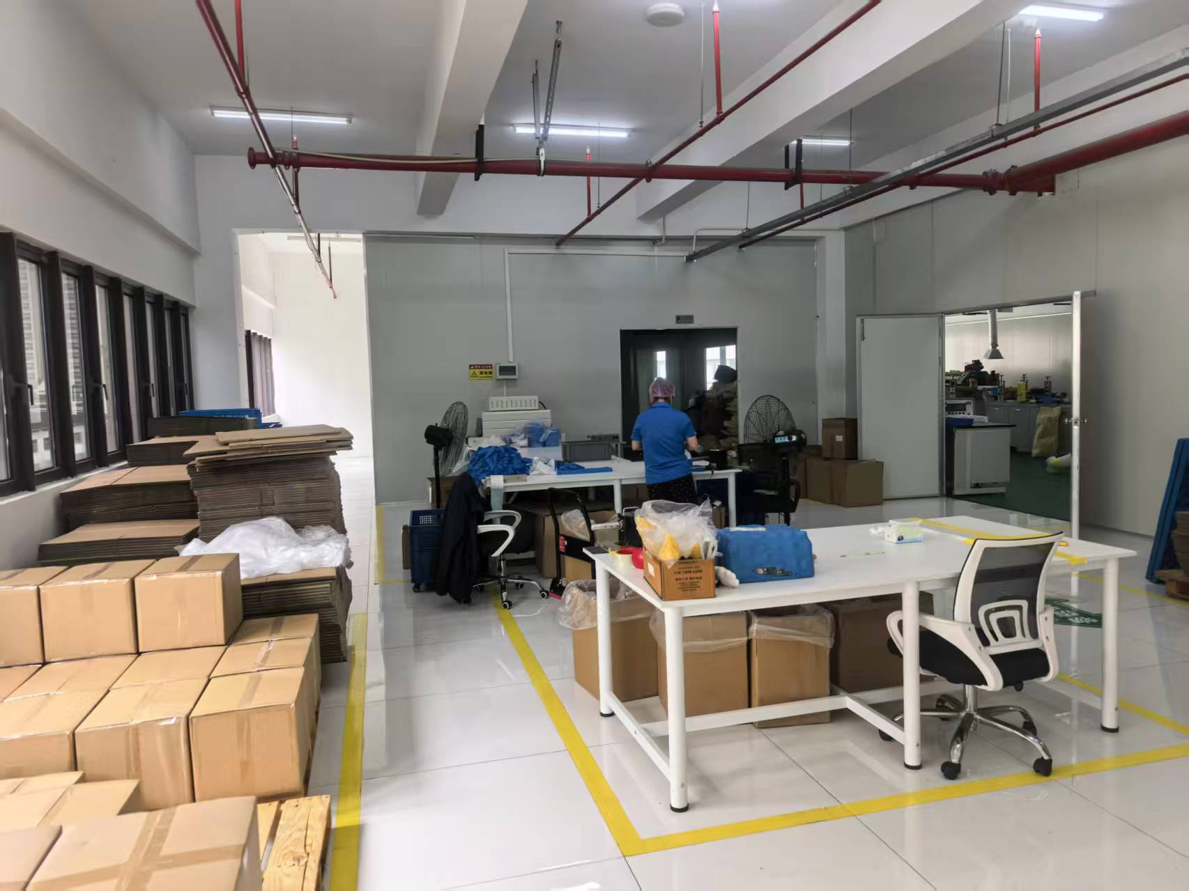 Packaging workshop with sealed cartons ready for dispatch
