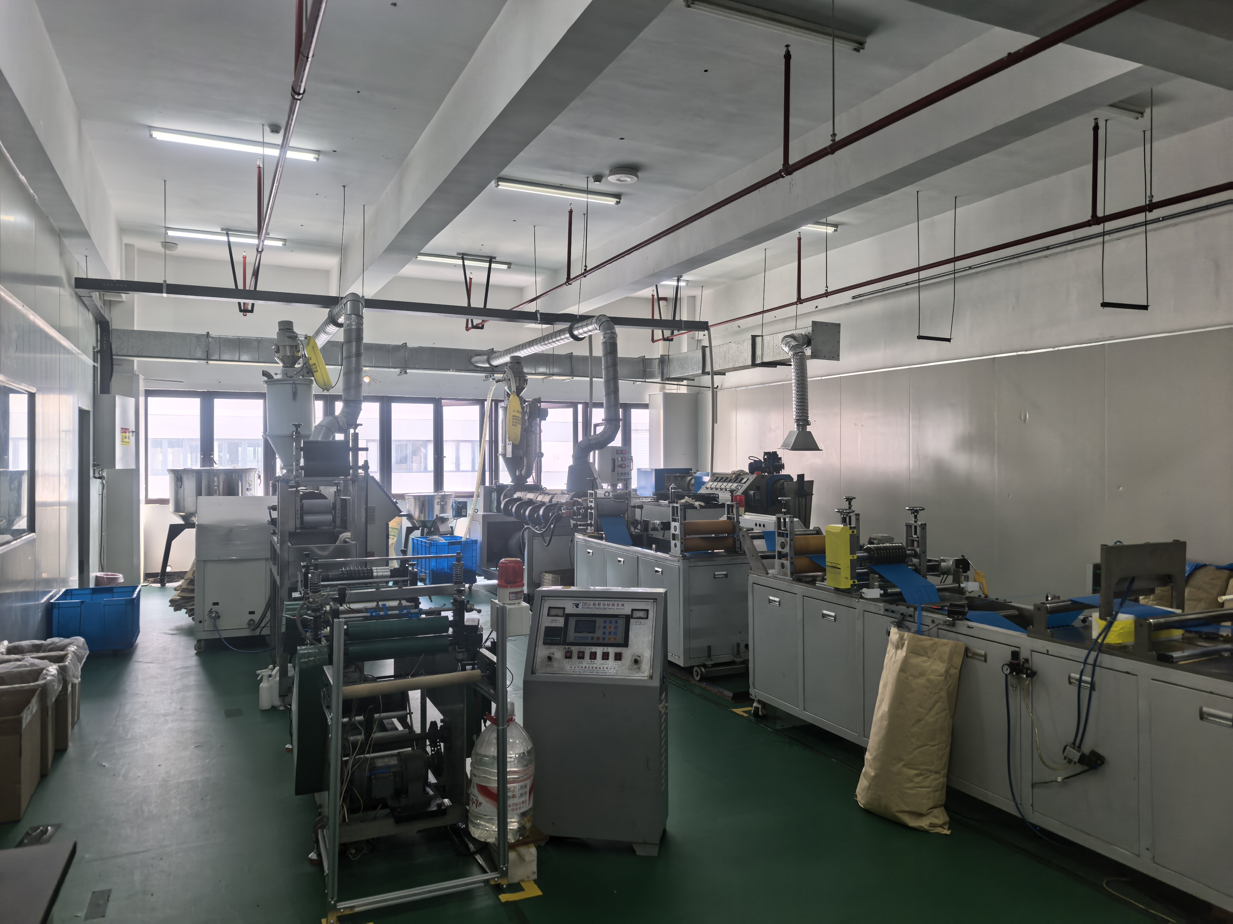 Extrusion and slitting machinery inside Friend's production workshop